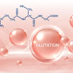 Glutation na co pomaga? Wizerunek przedstawia wzór chemiczny glutationu i różowe kuleczki, symbolizujące jego dobroczynne działanie.